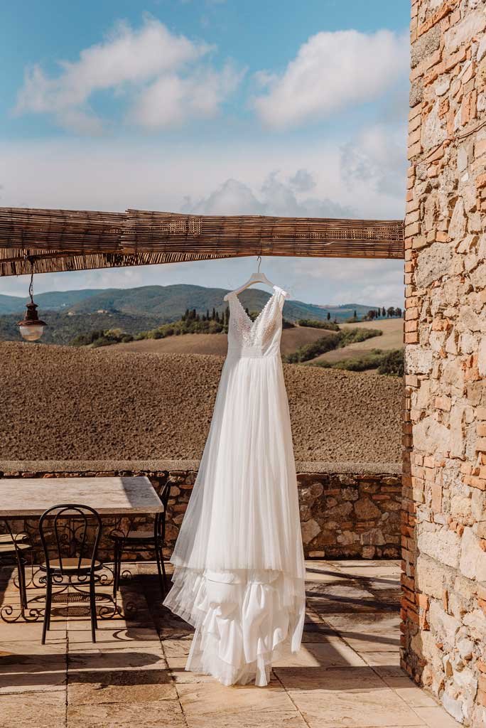 bride dress in tuscany fieds